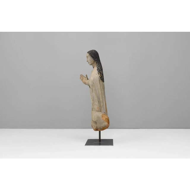 Carved wooden figure on later base. Circa 1800.