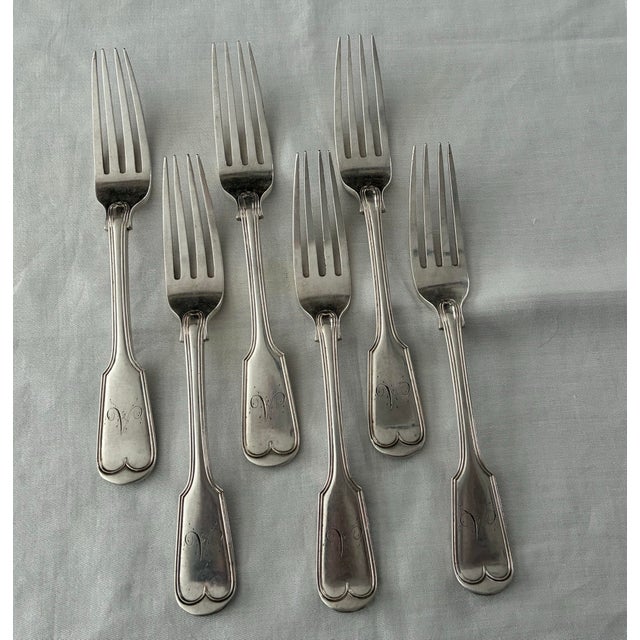 A substantial and elegant set of antique French sterling silver dinner forks in the classic Louis-Philippe fiddle pattern,...