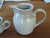 Measures approximately 7.25H x 8.5W to handle Body measures 6"W Very good condition