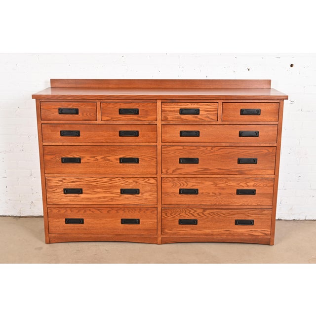 An outstanding Mission or Arts & Crafts style twelve-drawer dresser or chest of drawers In the manner of Stickley USA,...