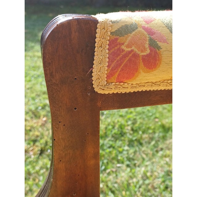 M27: A pair of English fireplace armchairs dating back to the early 19th century in a clean Regency style with a wide,...