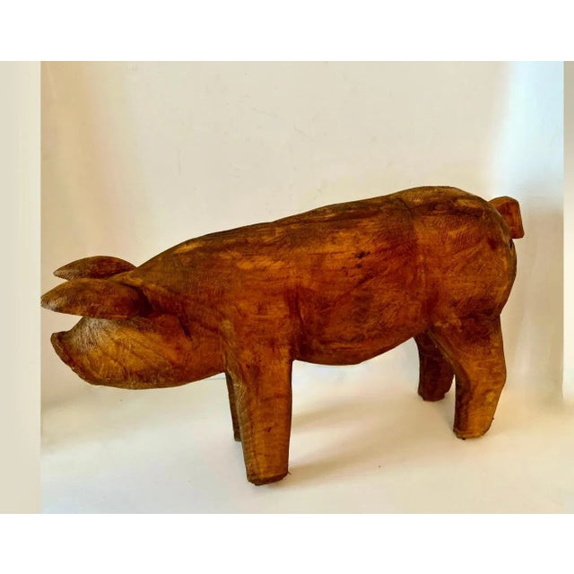 A hand Carved Wooden Pig - a compliment to many settings - great in the kitchen, on a shelf, console table, or even staged...