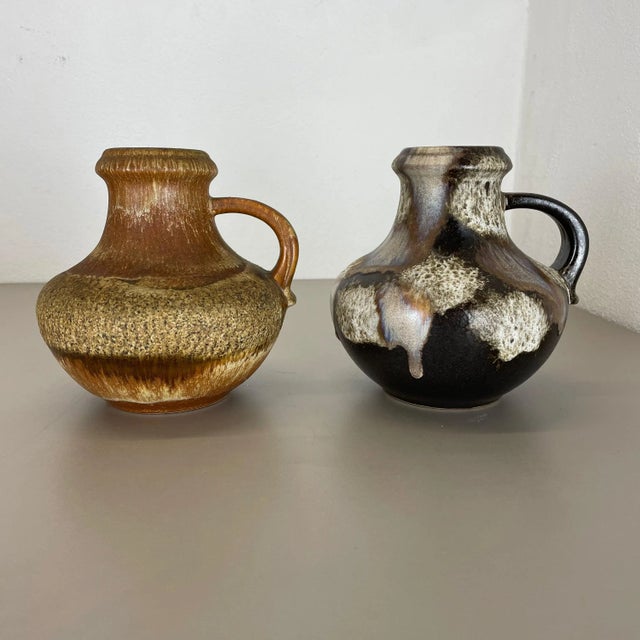 Article: Set of two fat lava art vases Producer: Scheurich, Germany Decade: 1970s These original vintage vases was...