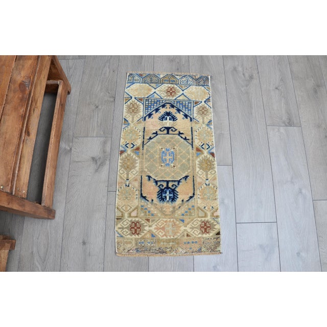 This is a vintage Turkish Oushak rug from the 1960s. The piece was hand-knotted.