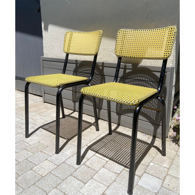 Pair of French Art-Prog Chairs, Yellow Woven Plastic and Black Tubular Steel, 1950s Elegant pair of French mid-century...