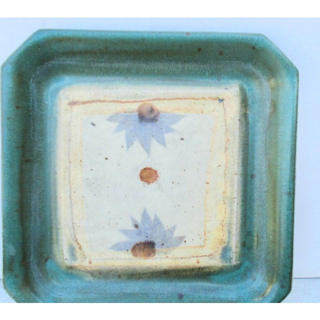 The terrific color and play of this square plate is wonderful. Lavender in a shade that sets beautifully against the olive...