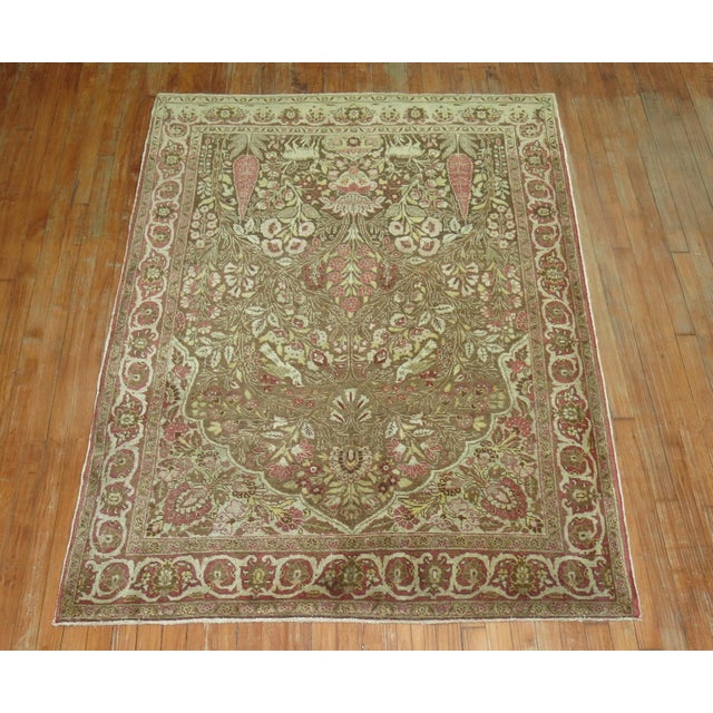 An early 20th century green and pink persian tabriz prayer animal design rug
