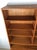 This Danish Modern shelving unit features pressed wood construction, beautiful teak veneer with original finish, six...