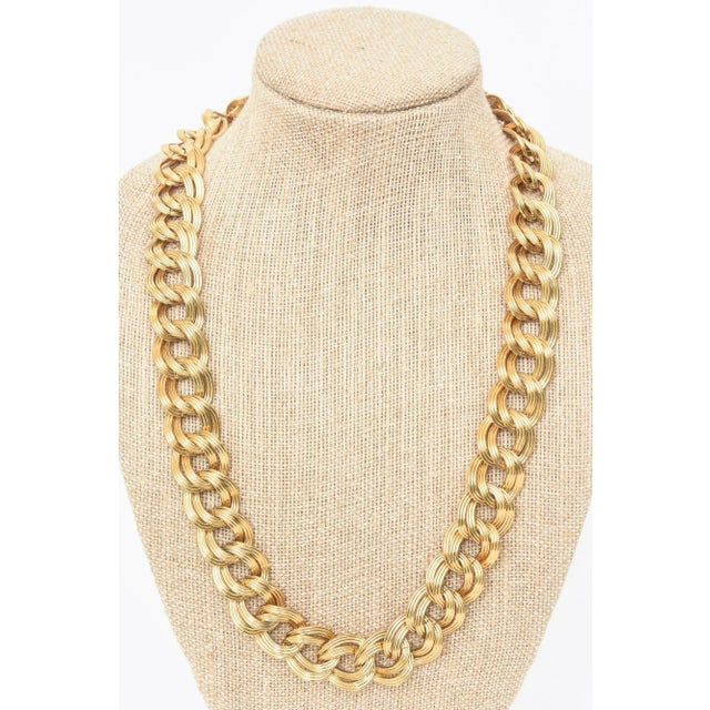 This is part of Chairish’s Costume Jewelry assortment. This substantial gold plated link necklace has a metal tag that...