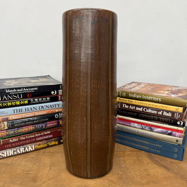 "About This Piece About This Piece Bring the quiet strength of nature indoors with this tall ceramic vase, defined by its...