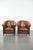 This comfortable and timeless set of two sheepskin club armchairs with a warm and charming vintage look. This stunning set...