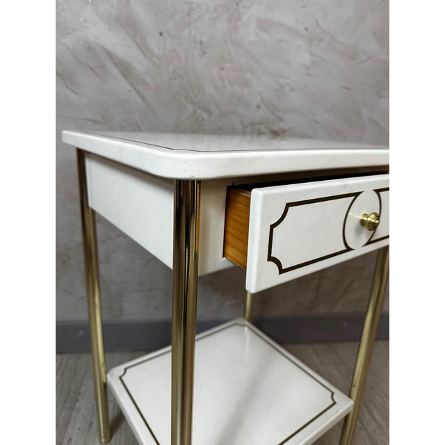 An elegant side table or bedside table from the 1980s, refinedly blending metal and brass in a chic and timeless style....