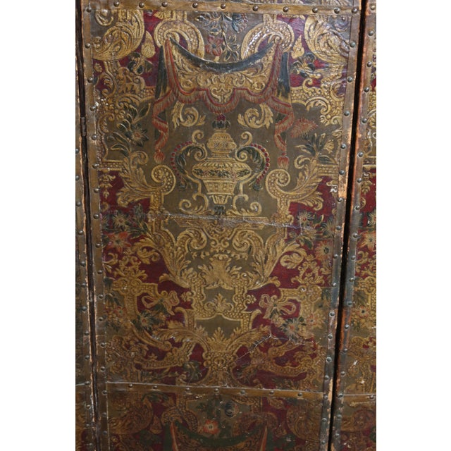 17th century cordovan leather screen a very beautiful 17th-century cordovan leather screen on a red background. It is...