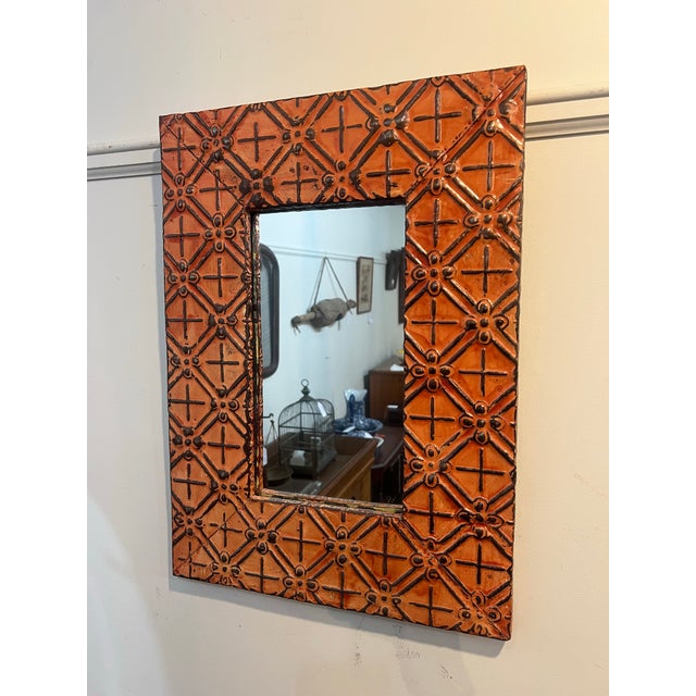 One of a kind Olde Good Things Mirror crafted of antique over 100 year old ceiling tin tiles. This is a vibrant burnt...