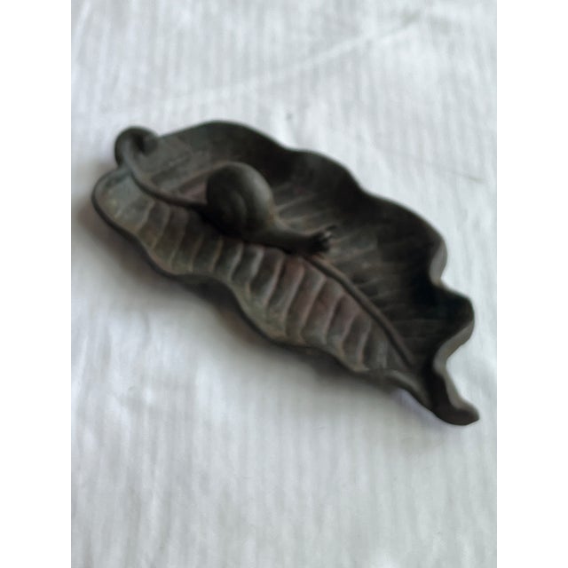 Beautiful vintage catchall of a snail sitting on a snail. Could be used on your porch, on your vanity or to hold keys.
