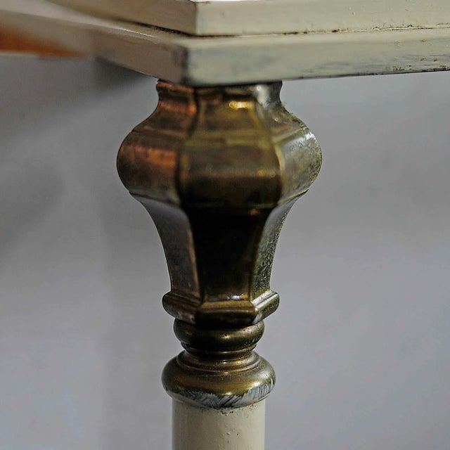 Vintage French Maison Jansen style painted iron coffee table with brass detail and glass top. Painted iron surface is worn...