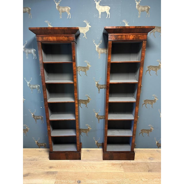 A beautiful set of small antique English bookcases. They feature a lovely, clean-lined style and a warm color. Each...