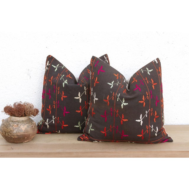 This curated set of two 18-inch square pillows offers a rare opportunity for symmetry, handcrafted from the same Antique...