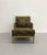 Elegant lounge chair featuring a faux bamboo frame with refined Asian-inspired detailing and plush loose cushions...