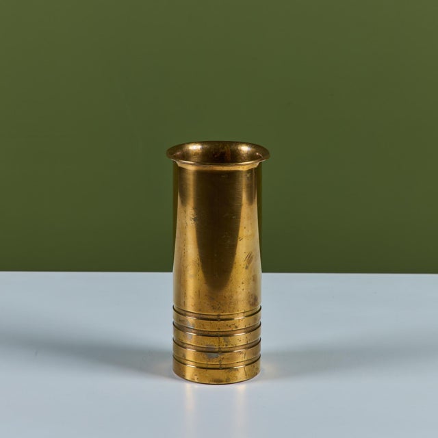 Brass vase by Walter von Nessen for Chase, c.1930s, USA. The solid patinated brass Art Deco vase features a tulip opening...