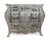 A stunning French Provincial bombé chest featuring elaborate carved floral and scroll work, finished in a distressed...