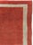 A vintage Turkish Oushak carpet from the second quarter of the 20th century featuring a minimalistic solid orange ground...