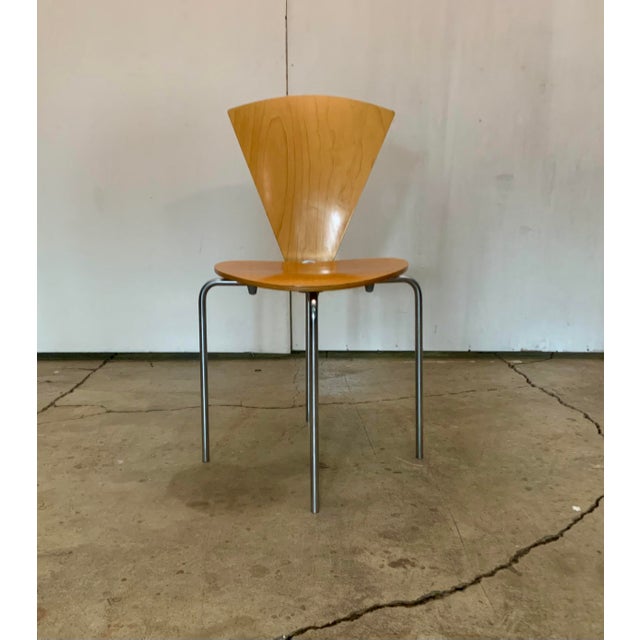 Set on five chairs with seat and back of plywood and frame of matt chrome-plated steel. Haugensen Design for Bent Krogh....
