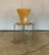 Set on five chairs with seat and back of plywood and frame of matt chrome-plated steel. Haugensen Design for Bent Krogh....