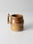Vintage handmade studio pottery mug featuring warm earth-tone glazes, a sculptural strap handle, and a softly shaped form....