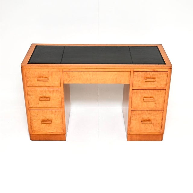 A superb Art Deco satin birch leather top pedestal desk, made in England and dating from the 1930’s. This is of amazing...