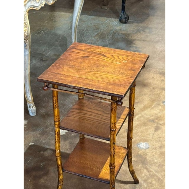 The Vintage Italian Bamboo and Oak Side Table is a unique and stylish piece of furniture that adds character to any room....