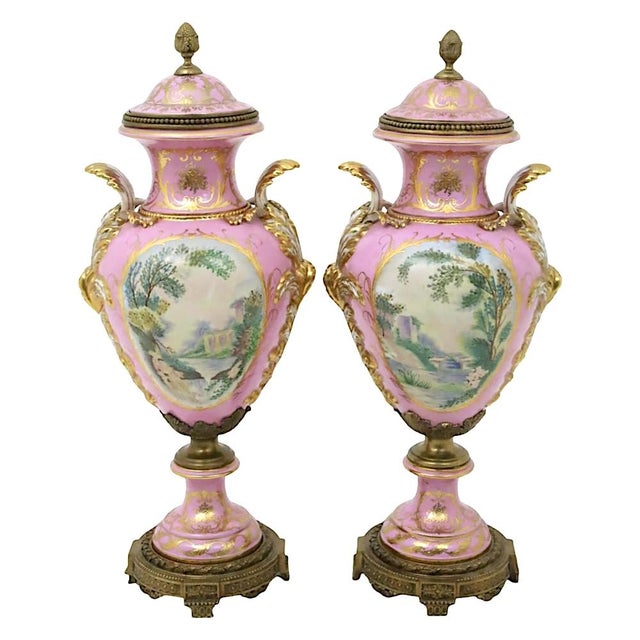 An impressive and monumental French Sèvres style porcelain covered centerpiece urn, made in France in the early to...