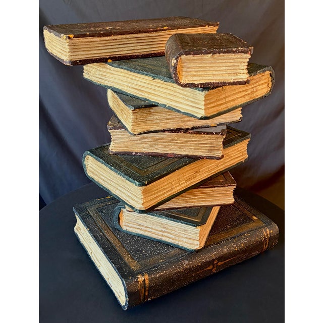 Vintage Regency-style accent table or nightstand designed in the trompe-l’œil form of a whimsical stacked library of...