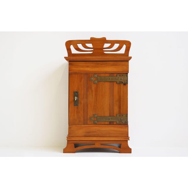 Gorgeous Dutch antique Art Nouveau wall cabinet from the 1910s. Gorgeous Art nouveau lines in solid wood with high quality...