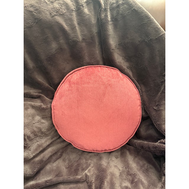 One round pillow in a luxurious, earthy shade of reddish chenille, approximately 15 inches by 2.5 deep. A soft and lovely...