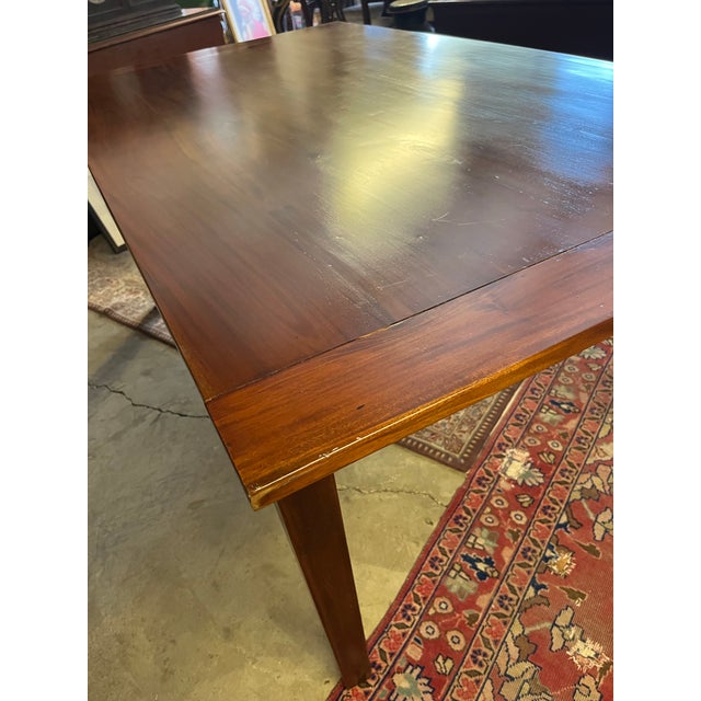 Beautiful reddish brown farmhouse style table with tapered legs, scroll cut apron and breadboard ends. Good vintage...