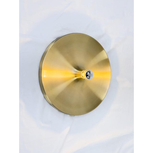 Stunning Honsel wall lamp in brushed brass finish (selected by Charlotte Periand for the interior design of Les Arcs). •...