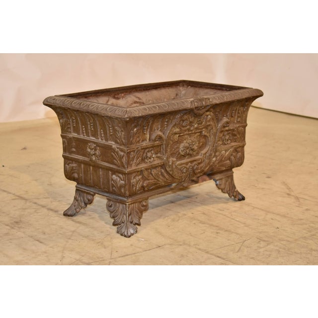 Large scale jardiniere, dating to circa 1890-1900. This jardiniere is of decorative cast iron construction. These were...