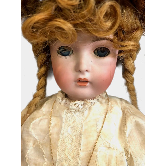 On offer is a highly collectible German bisque head child doll manufactured by J.D. Kestner. This doll features a finely...