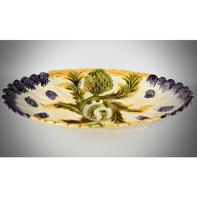 A stylish polychrome 19th century French majolica serving platter with embossed depictions of asparagus and artichokes...
