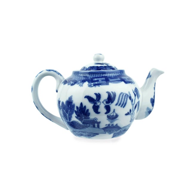 This charming Blue Willow Design Teapot is a classic piece that will add a touch of vintage elegance to your tea time....