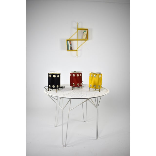 Available in black, yellow and red. The highly collectible 'Java' lamp, circa 1953, embodies Mathieu Matégot's artistic...