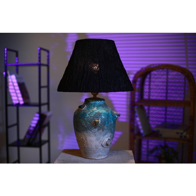 Ocean Handmade Ceramic Lamp A sculptural ceramic lamp inspired by the depth and movement of the ocean. The rich blue tones...