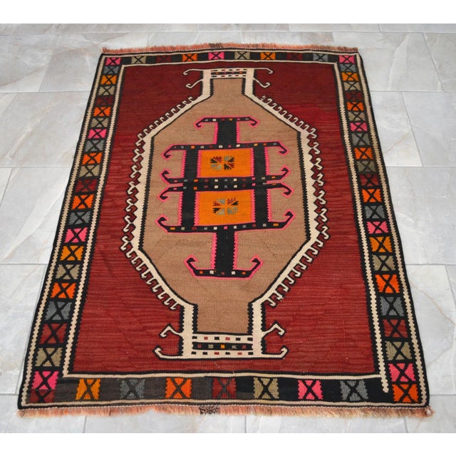This handwoven vintage Kilim rug has fun & cheerful colors. This petite Kilim is a really rare find! The colors, the...