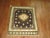 Quirky East Turkmenistan rug with a teapo tmedallion, accents in canteloupe and ivory on a brown field. The weaver...