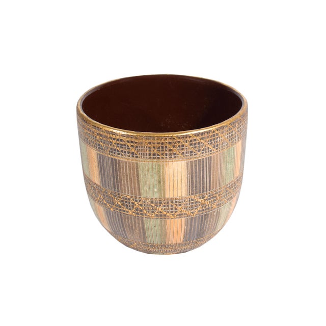 A vintage Seta planter pot produced by Bitossi. Made in Italy, this ceramic pot features incised vertical and cross-...