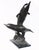 Wonderful statue showing a pair of entwined dolphins Stands on a black marble base which is smooth and chip free Of course...