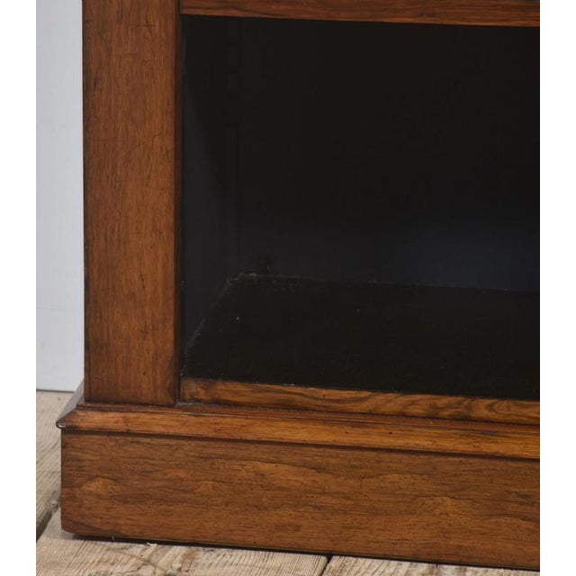 Fine 19th-century open bookcase, crafted from richly figured rosewood with a warm patina that enhances its natural beauty....