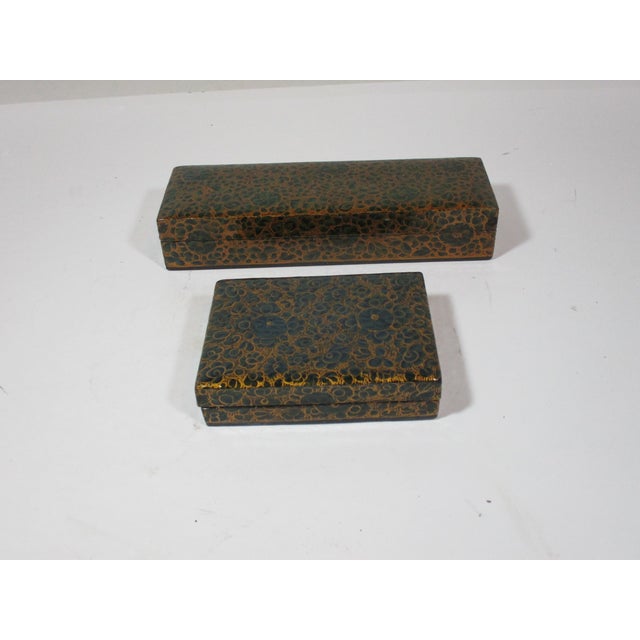 Set of 2 Kashmir India completely handmade paper mache' lacquer boxes. They are decorated all over with floral designs,...