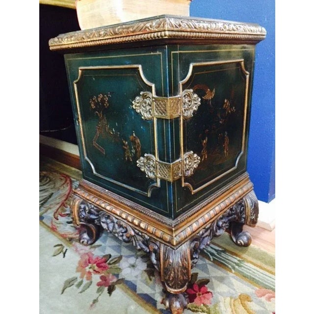 From an English estate (early 1900's), this chic pair of chinoiserie cabinets are done in a lovely dark green lacquer....